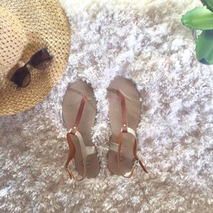 Tan and gold ankle strap flat sandals